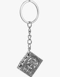 Silver keychain with intricate design on a white background